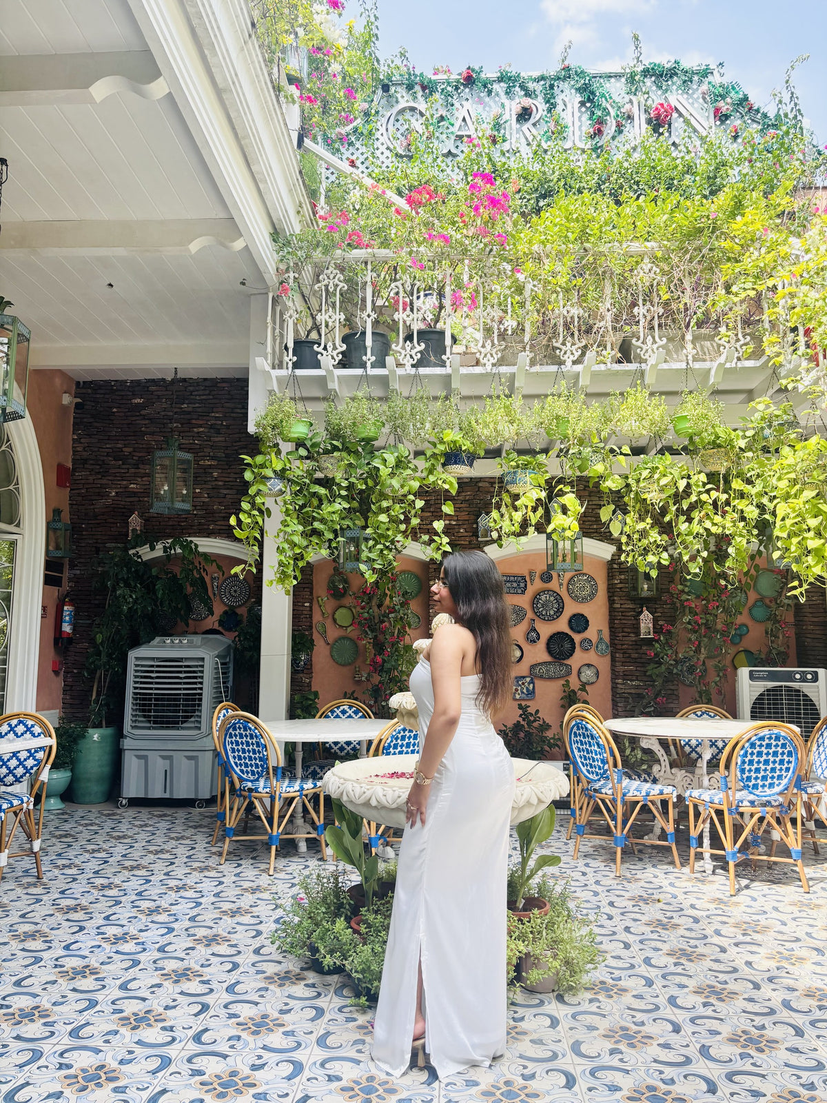 Taara ivory strapless column maxi dress, side view showing the front slit